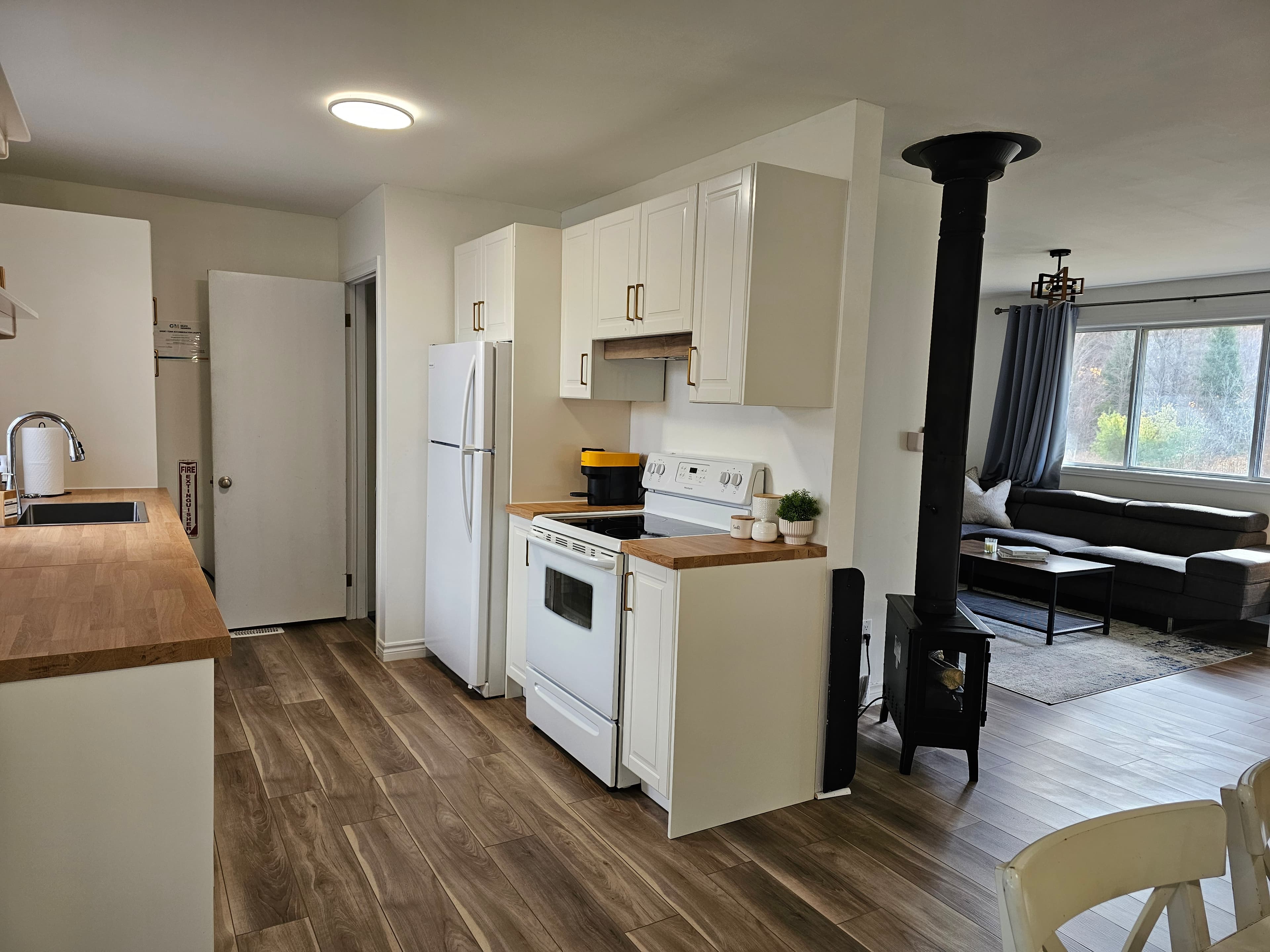 Kitchen and living area at Stillwater Escape
